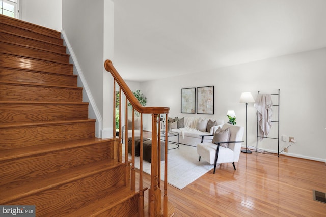 9109 Knox Ct, Laurel, MD 20723 - stairway featuring wood finished floors, healthy amount of natural light, and baseboards