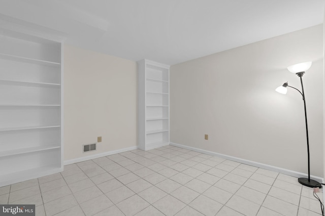 9109 Knox Ct, Laurel, MD 20723 - empty room featuring built in features, baseboards, and light tile patterned floors