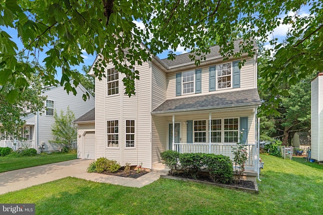 9109 Knox Ct, Laurel, MD 20723 - traditional-style home featuring covered porch, a front lawn, concrete driveway, and a garage