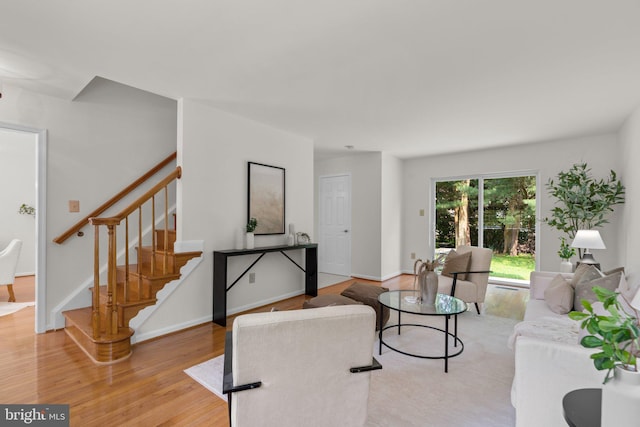 9109 Knox Ct, Laurel, MD 20723 - living room with stairway, light wood-type flooring, and baseboards