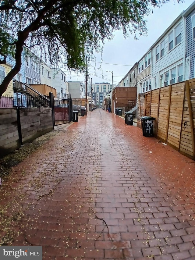 1131 Abbey Pl NE, Washington, DC 20002 - view of decorative alley featuring a gate and street lighting