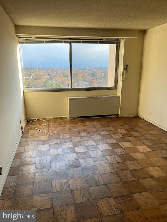 4515 Willard Ave Unit 2309S, Chevy Chase, MD 20815 - spare room featuring radiator and baseboards
