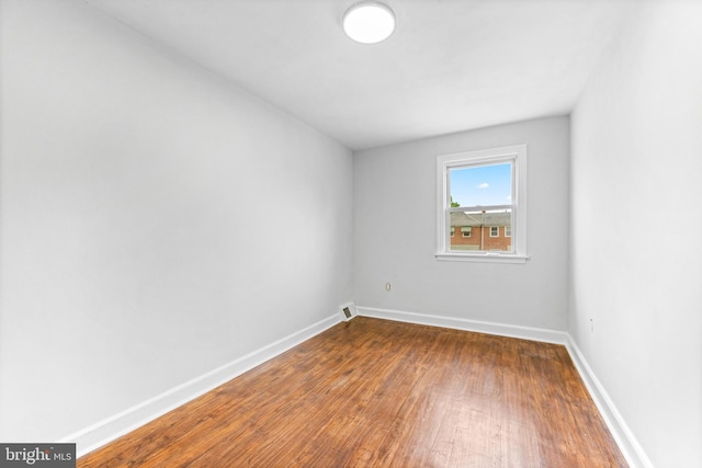 2134 Firethorn Rd, Middle River, MD 21220 - spare room featuring wood finished floors and baseboards