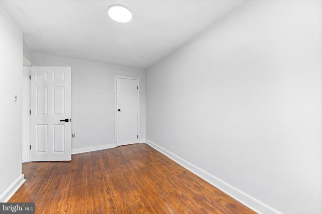 2134 Firethorn Rd, Middle River, MD 21220 - unfurnished bedroom featuring dark wood-style floors and a closet