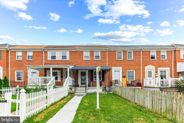 2134 Firethorn Rd, Middle River, MD 21220 - multi unit property with a porch, brick siding, and a fenced front yard