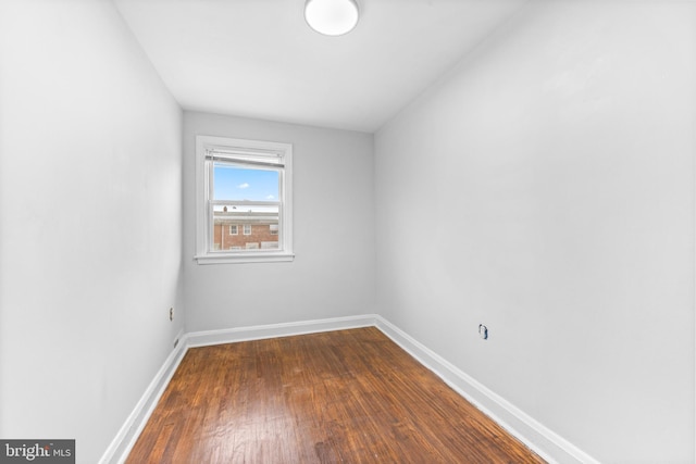 2134 Firethorn Rd, Middle River, MD 21220 - spare room featuring dark wood-style floors and baseboards