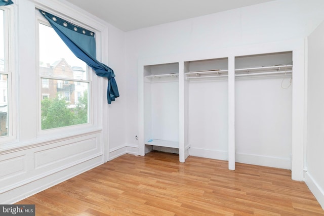 2308 N Park Ave, Philadelphia, PA 19132 - unfurnished bedroom featuring light wood-style flooring and two closets