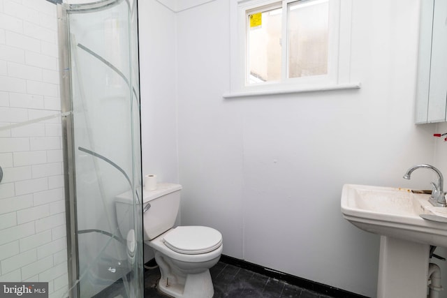 2308 N Park Ave, Philadelphia, PA 19132 - bathroom featuring a shower, toilet, and a sink