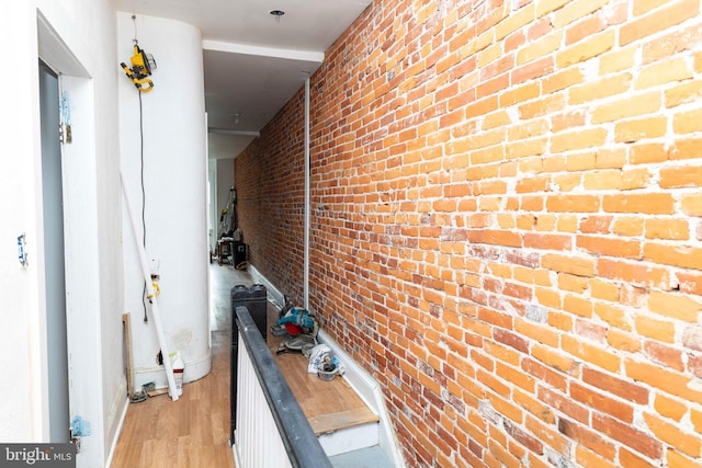 2308 N Park Ave, Philadelphia, PA 19132 - corridor with light wood finished floors and brick wall