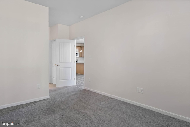 35031 Dundee St Unit 6, Frankford, DE 19945 - carpeted spare room with baseboards