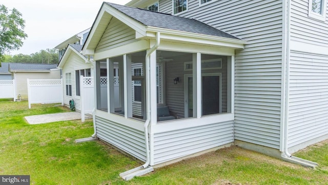 35031 Dundee St Unit 6, Frankford, DE 19945 - view of side of home featuring a sunroom and roof with shingles