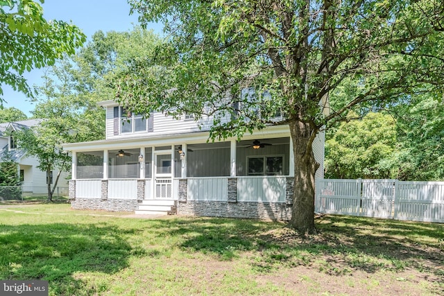18552 Three Notch Rd, Lexington Park, MD 20653 - view of front of house with ceiling fan, stone siding, board and batten siding, and a sunroom