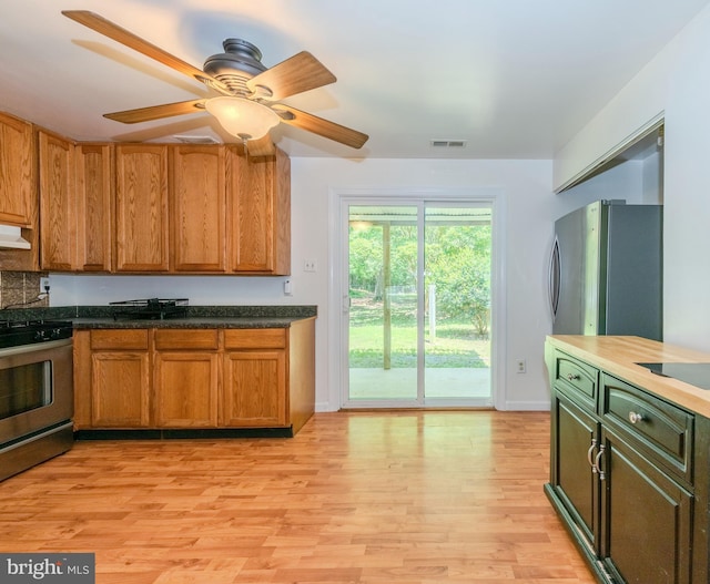 18552 Three Notch Rd, Lexington Park, MD 20653 - kitchen featuring stainless steel appliances, light wood finished floors, ceiling fan, and baseboards