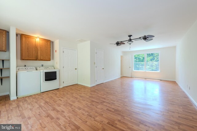18552 Three Notch Rd, Lexington Park, MD 20653 - unfurnished living room with light wood-style floors, ceiling fan, baseboards, and washing machine and dryer
