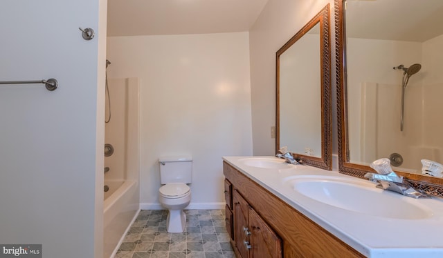 18552 Three Notch Rd, Lexington Park, MD 20653 - bathroom with double vanity, toilet, washtub / shower combination, and baseboards