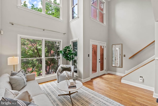 1406 Corcoran St NW Unit D, Washington, DC 20009 - living area with plenty of natural light, a towering ceiling, wood finished floors, and stairs