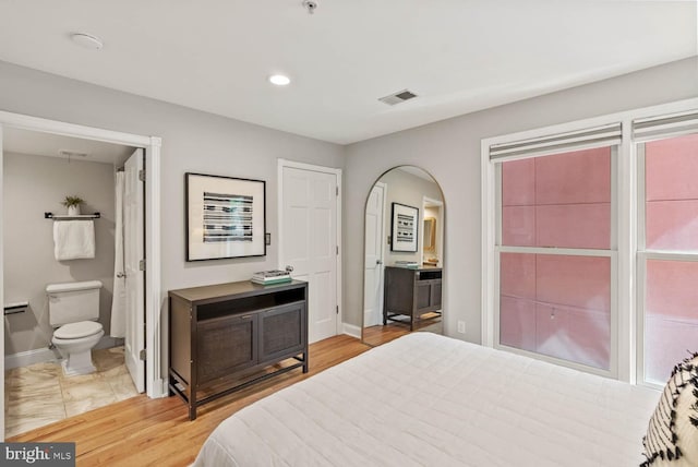 1406 Corcoran St NW Unit D, Washington, DC 20009 - bedroom featuring ensuite bath, recessed lighting, arched walkways, and light wood finished floors