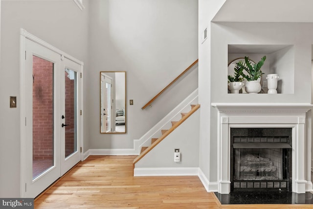 1406 Corcoran St NW Unit D, Washington, DC 20009 - foyer featuring wood finished floors, stairway, and a fireplace