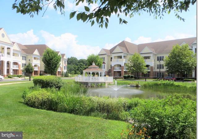2102 Meridian Blvd Unit 2102, Warrington, PA 18976 - view of community with a lawn, a gazebo, and a water view
