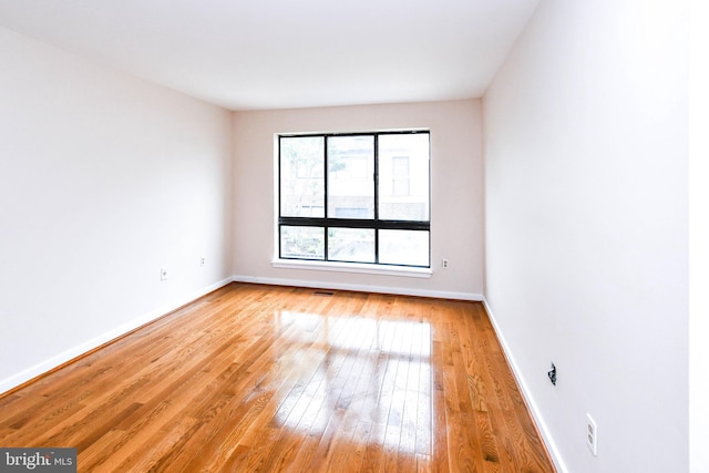 49 Hawthorne Ct NE Unit 49, Washington, DC 20017 - unfurnished room featuring baseboards and light wood-style flooring
