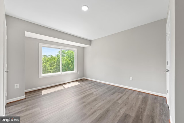 10779 Primrose Ct, Manassas, VA 20109 - empty room with wood finished floors and baseboards