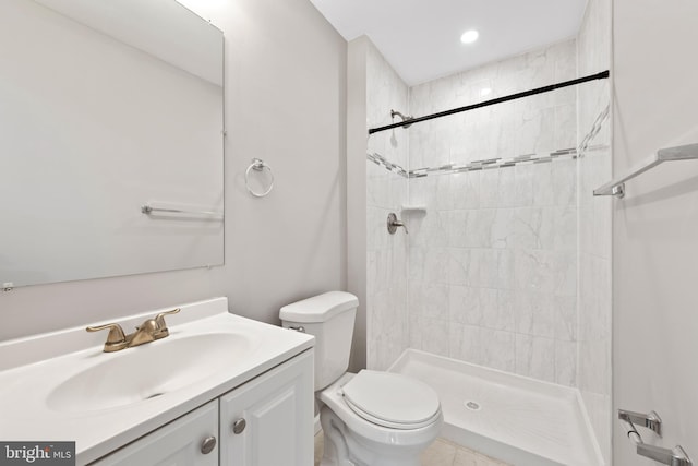 10779 Primrose Ct, Manassas, VA 20109 - bathroom with toilet, vanity, and a tile shower