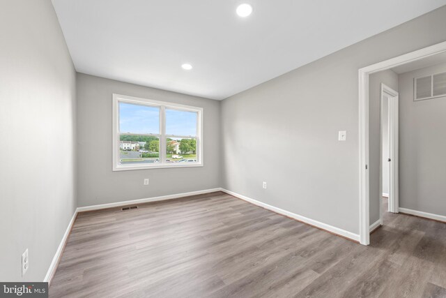 10779 Primrose Ct, Manassas, VA 20109 - spare room featuring baseboards, wood finished floors, and recessed lighting