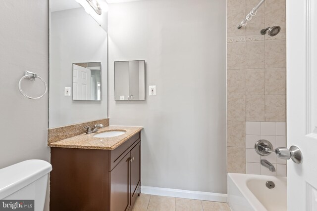 10779 Primrose Ct, Manassas, VA 20109 - bathroom featuring toilet, tile patterned flooring, vanity, shower / bathtub combination, and baseboards