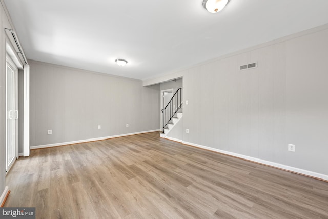 10779 Primrose Ct, Manassas, VA 20109 - unfurnished room featuring stairs, wood finished floors, and baseboards