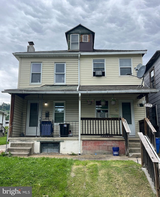 619-621 Riverside Dr, Lewistown, PA 17044 - view of front of property featuring covered porch, a chimney, a front lawn, and cooling unit
