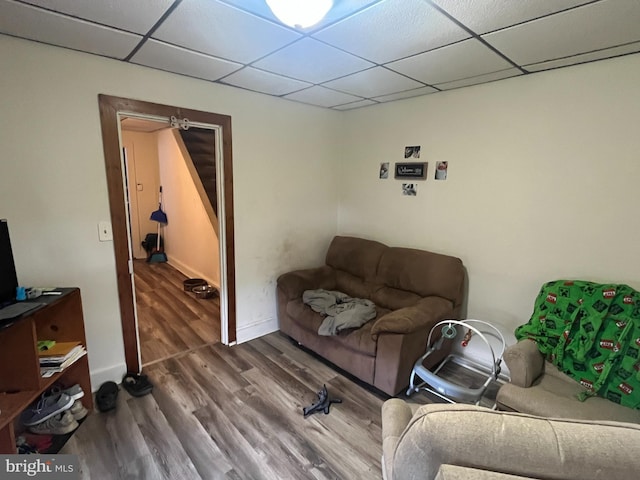 619-621 Riverside Dr, Lewistown, PA 17044 - living room with wood finished floors, a paneled ceiling, and baseboards