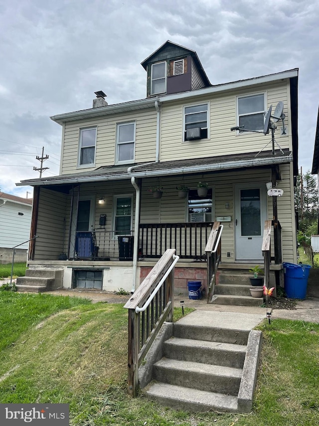 619-621 Riverside Dr, Lewistown, PA 17044 - townhome / multi-family property with a porch, a front yard, and cooling unit