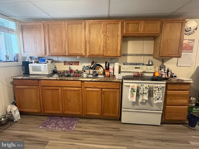619-621 Riverside Dr, Lewistown, PA 17044 - kitchen with white appliances, a sink, light wood-style floors, a paneled ceiling, and brown cabinets