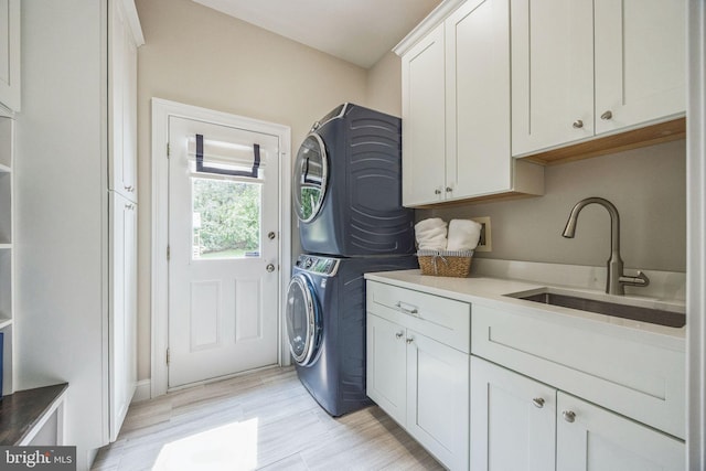 31 Bramley Rd, Moorestown, NJ 08057 - laundry room featuring stacked washer / dryer, cabinet space, and light wood-style floors