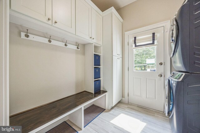 31 Bramley Rd, Moorestown, NJ 08057 - mudroom featuring stacked washing machine and dryer and light wood-style floors