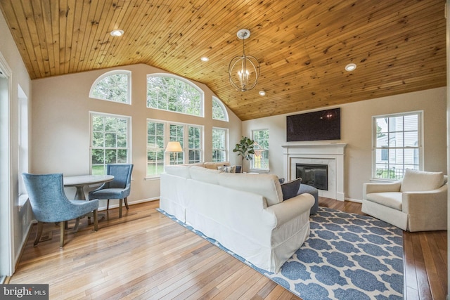 31 Bramley Rd, Moorestown, NJ 08057 - living area with a glass covered fireplace, plenty of natural light, hardwood / wood-style flooring, wood ceiling, and recessed lighting