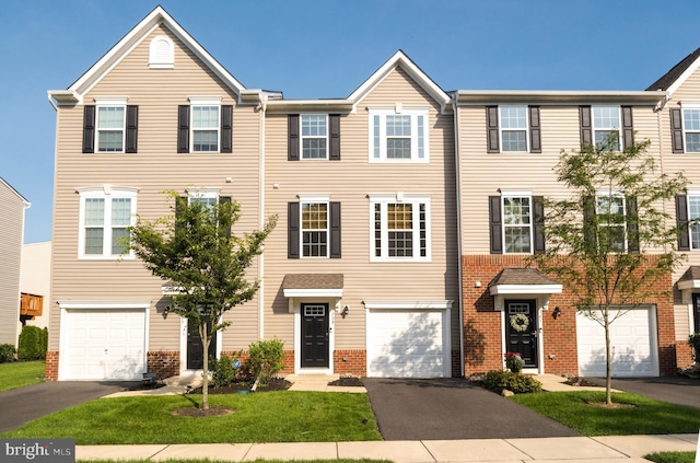 159 Nathan Dr, Cinnaminson, NJ 08077 - townhome / multi-family property with brick siding, driveway, a garage, and a front lawn