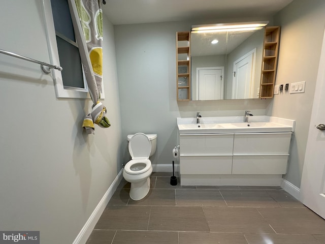 916 Snyder Ave, Philadelphia, PA 19148 - bathroom with double vanity, toilet, baseboards, and tile patterned floors