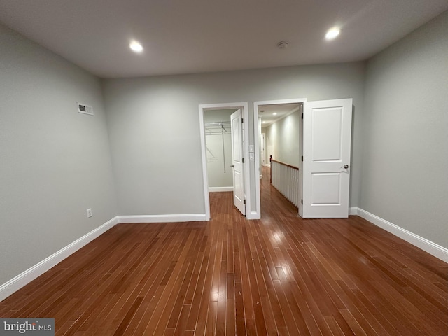916 Snyder Ave, Philadelphia, PA 19148 - unfurnished bedroom featuring a spacious closet, baseboards, dark wood finished floors, a closet, and recessed lighting