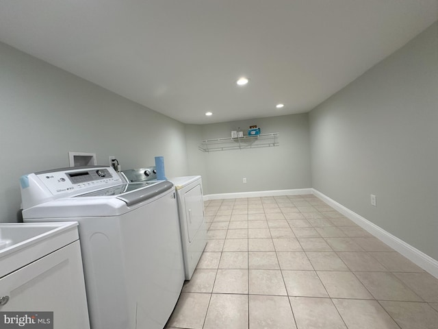 916 Snyder Ave, Philadelphia, PA 19148 - laundry area featuring washer and dryer, recessed lighting, light tile patterned flooring, and baseboards