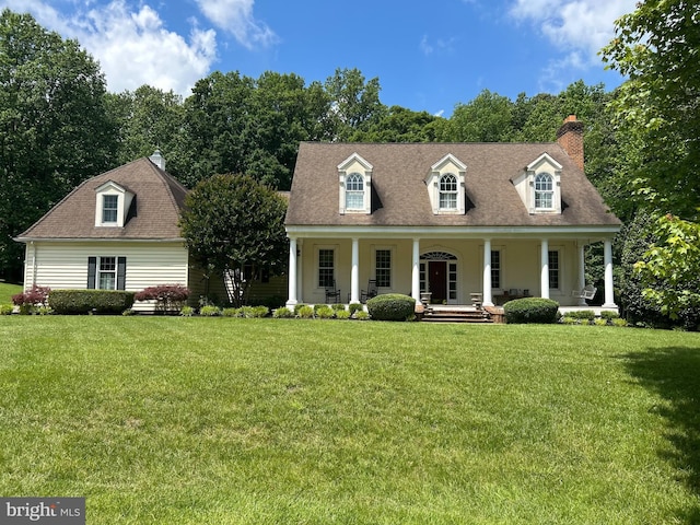 1918 Mackiebeth Ct, Annapolis, MD 21401 - cape cod-style house featuring a chimney, a front yard, covered porch, and a shingled roof