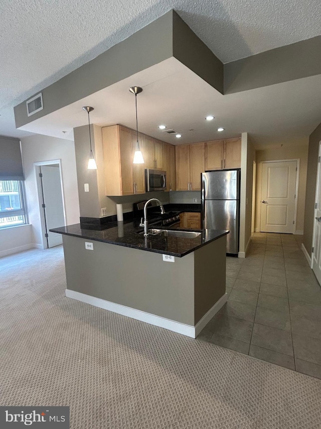 820 N Pollard St Unit 413, Arlington, VA 22203 - kitchen featuring appliances with stainless steel finishes, a peninsula, baseboards, recessed lighting, and decorative light fixtures