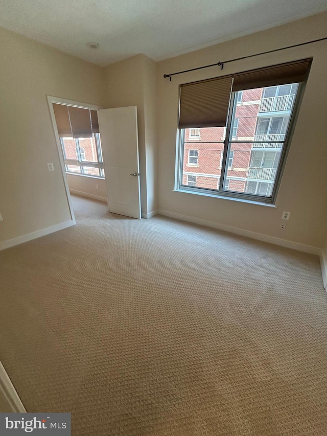 820 N Pollard St Unit 413, Arlington, VA 22203 - spare room with light carpet and baseboards