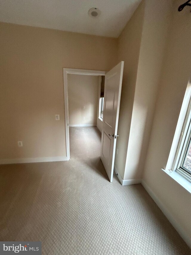 820 N Pollard St Unit 413, Arlington, VA 22203 - empty room featuring light carpet and baseboards