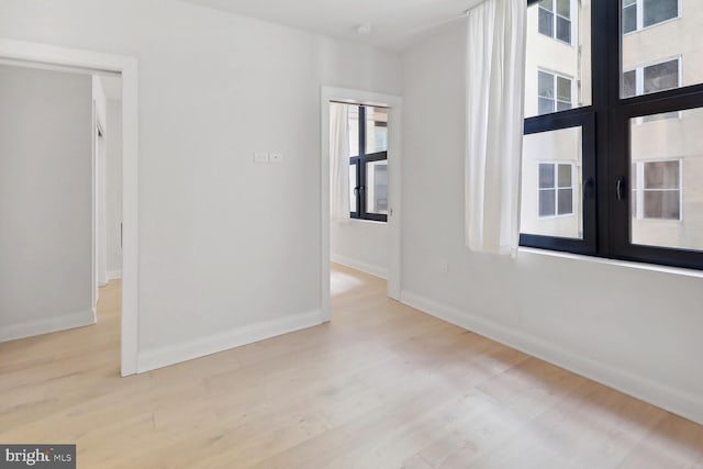 1427 Rhode Island Ave NW Unit 202, Washington, DC 20005 - empty room featuring wood finished floors, baseboards, and french doors