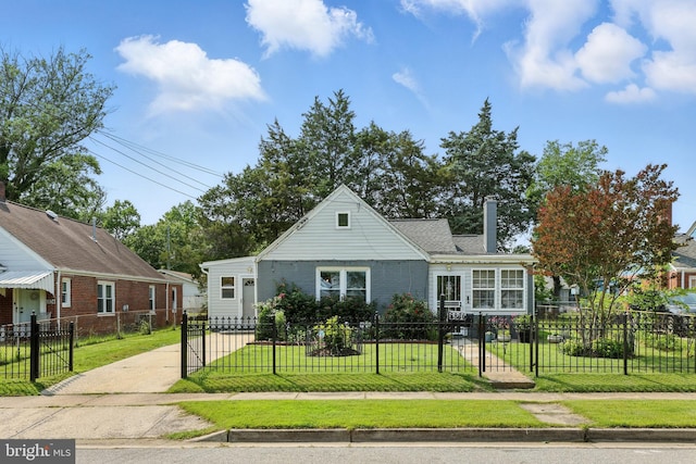 6836 Standish Dr, Hyattsville, MD 20784 - view of front of house featuring a chimney and concrete driveway