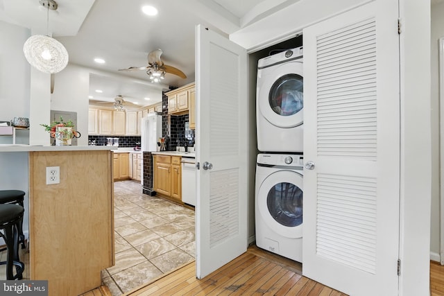 6836 Standish Dr, Hyattsville, MD 20784 - washroom with estacked washer and dryer, recessed lighting, ceiling fan, and light wood-type flooring
