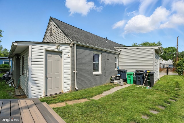 6836 Standish Dr, Hyattsville, MD 20784 - rear view of house with a yard and roof with shingles