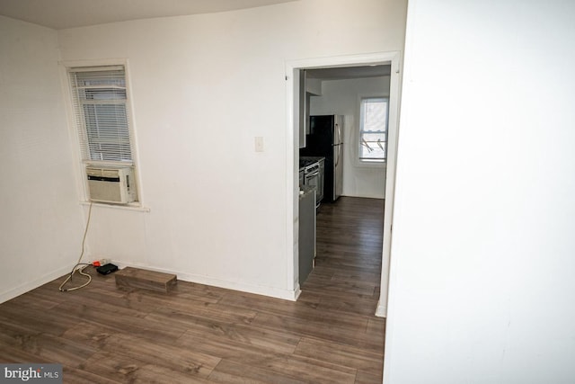 1011 Andrews Ave, Darby, PA 19023 - empty room featuring dark wood-style floors, cooling unit, and baseboards