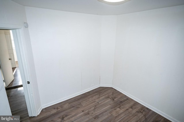 1011 Andrews Ave, Darby, PA 19023 - empty room with dark wood-style floors and baseboards